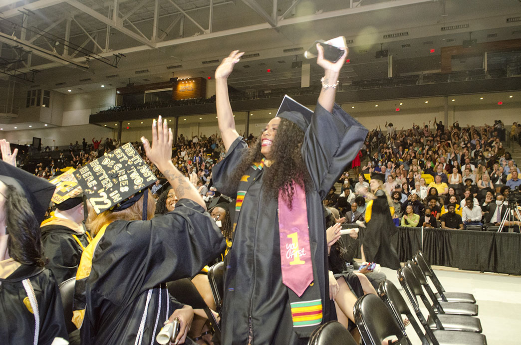 New graduates celebrate during the May 2022 Commencement ceremony.