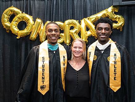 VCU athletics administrator Sofia Hiort-Wright with two graduating student-athletes.