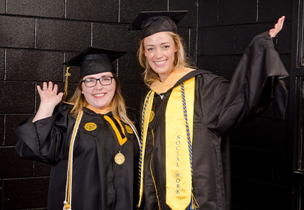 Summer D. Jones, B.S.W. graduate, and Summer C. Jones, M.S.W. graduate, pose before the May 2022 Commencement ceremony.